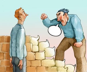 cartoon of man's profanity speech bubbles building a wall between people