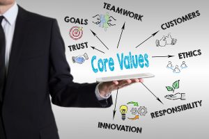 Core Values concept with young man holding a tablet computer.