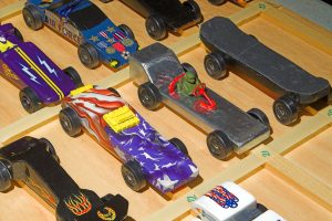 A collection of Pinewood Derby cars ready to race.