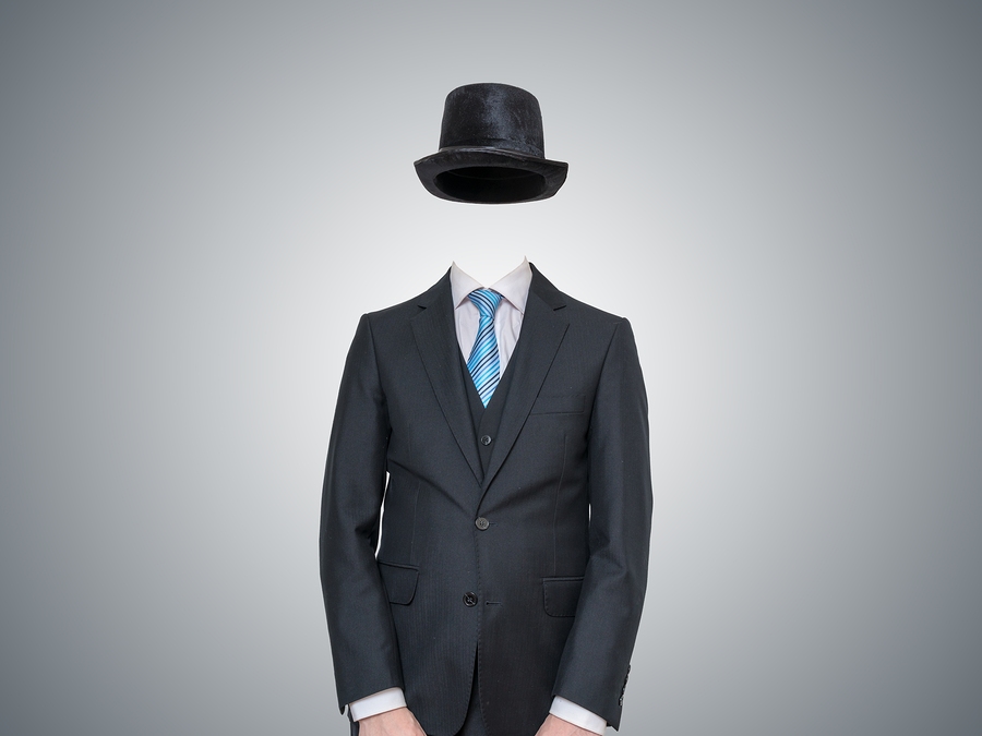 invisible man in suit on gray background. Invisible Influence.